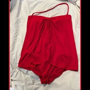 Beautiful bright red one piece .  Vey flattering and slimming.